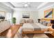 Bright bedroom featuring hardwood floors, modern decor and large window at 1832 Glenwood Ln, Snellville, GA 30078