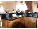 Stylish bar area featuring wooden cabinets, a countertop, and plants as decor at 5188 Ashley Se Dr, Covington, GA 30014