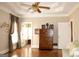 Spacious bedroom featuring a tray ceiling, hardwood floors, and neutral paint at 5188 Ashley Se Dr, Covington, GA 30014