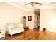 Bright bedroom featuring hardwood floors, neutral colors, and white trim at 5188 Ashley Se Dr, Covington, GA 30014