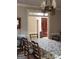 Bright dining room featuring a view into the foyer with a dark wood door at 5188 Ashley Se Dr, Covington, GA 30014