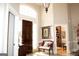 Elegant foyer with a dark wood front door, arched window, and a decorative bench at 5188 Ashley Se Dr, Covington, GA 30014