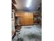 Spacious garage with ample cabinet storage, desk area, and room for vehicles at 5188 Ashley Se Dr, Covington, GA 30014