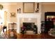 Bright living room features a fireplace, hardwood floors, and decorative furnishings and finishes at 5188 Ashley Se Dr, Covington, GA 30014