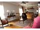 Inviting living room with wood floors, a ceiling fan, comfortable seating, and natural light at 5188 Ashley Se Dr, Covington, GA 30014