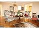 Living room with dining area and decorative furnishings and finishes and hardwood floors at 5188 Ashley Se Dr, Covington, GA 30014