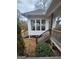 View of a sunroom with stairs leading down to the backyard at 5188 Ashley Se Dr, Covington, GA 30014