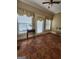 The sunroom features tile floors and a table with two windows on the back wall at 5188 Ashley Se Dr, Covington, GA 30014