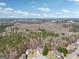An aerial view showcases the home's serene setting, surrounded by lush greenery and a tranquil neighborhood atmosphere at 204 Eleanor Ct, Stockbridge, GA 30281