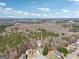An aerial view shows the home's serene setting surrounded by lush greenery and a tranquil neighborhood atmosphere at 204 Eleanor Ct, Stockbridge, GA 30281