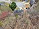 An aerial view showcases the house in the neighborhood surrounded by lush greenery and a tranquil atmosphere at 204 Eleanor Ct, Stockbridge, GA 30281