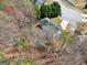 An aerial view showcases the house in the neighborhood surrounded by lush greenery and a tranquil atmosphere at 204 Eleanor Ct, Stockbridge, GA 30281