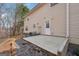 Exterior home view featuring a patio and back door leading to a spacious yard at 204 Eleanor Ct, Stockbridge, GA 30281