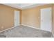 Bedroom with carpet, light walls and white doors at 204 Eleanor Ct, Stockbridge, GA 30281