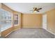 Bright bedroom with neutral carpet, a large window, and a closet door at 204 Eleanor Ct, Stockbridge, GA 30281
