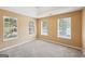 Bedroom with carpet and three windows at 204 Eleanor Ct, Stockbridge, GA 30281