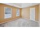 Bedroom with carpet and two windows at 204 Eleanor Ct, Stockbridge, GA 30281