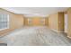 Large bonus room with neutral paint and many windows at 204 Eleanor Ct, Stockbridge, GA 30281