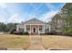 Attractive clubhouse featuring a covered porch supported by large white columns and a bright red front door at 204 Eleanor Ct, Stockbridge, GA 30281