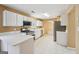 Bright kitchen features white cabinets, stainless steel appliances, and quartz countertops at 204 Eleanor Ct, Stockbridge, GA 30281