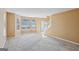 Bright living room with large windows providing natural light and soft, neutral carpet at 204 Eleanor Ct, Stockbridge, GA 30281