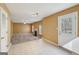 View of open concept living room that showcases flooring, a fireplace and doorway to the kitchen at 204 Eleanor Ct, Stockbridge, GA 30281
