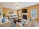 Staged living room features two sofas and accent chairs surrounding a decorative center table at 204 Eleanor Ct, Stockbridge, GA 30281