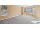 Spacious living room with ample windows and new carpet at 204 Eleanor Ct, Stockbridge, GA 30281