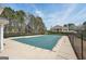 Community pool located near the clubhouse and surrounded by lush landscaping at 204 Eleanor Ct, Stockbridge, GA 30281