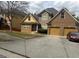 Charming brick two-story home featuring a two-car garage and well-maintained front yard at 4371 Minkslide Sw Dr, South Fulton, GA 30331