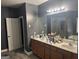 Spacious bathroom featuring a double vanity, tile flooring, and neutral color palette at 4371 Minkslide Sw Dr, South Fulton, GA 30331
