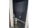 Small water closet with toilet and dark paint at 4371 Minkslide Sw Dr, South Fulton, GA 30331