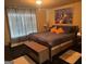 Cozy bedroom featuring a comfortable bed and natural light from the large window at 4371 Minkslide Sw Dr, South Fulton, GA 30331