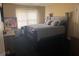 Bedroom with a dark wood frame bed and neutral window coverings at 4371 Minkslide Sw Dr, South Fulton, GA 30331