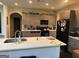 Open kitchen featuring a large island with bar seating and modern appliances at 4371 Minkslide Sw Dr, South Fulton, GA 30331