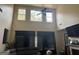 Spacious living room with high ceilings, fireplace and lots of natural light from large windows at 4371 Minkslide Sw Dr, South Fulton, GA 30331