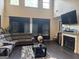 Spacious living room with a fireplace, high ceilings and large windows allowing natural light at 4371 Minkslide Sw Dr, South Fulton, GA 30331