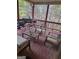 Relaxing screened-in porch with wood furnishings and a view of the outdoors at 4371 Minkslide Sw Dr, South Fulton, GA 30331