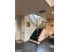 Carpeted staircase with wooden railings at 4371 Minkslide Sw Dr, South Fulton, GA 30331