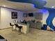 Convenient wet bar area with a custom counter, seating, and cabinetry at 4371 Minkslide Sw Dr, South Fulton, GA 30331