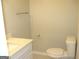Half bathroom featuring modern toilet, vanity, and brushed nickel hardware at 5017 Galbraith Cir, Stone Mountain, GA 30088