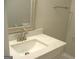 Bathroom featuring marble vanity, brushed nickel hardware and a framed mirror at 5017 Galbraith Cir, Stone Mountain, GA 30088