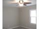 Cozy bedroom with neutral paint, vinyl floors, ceiling fan and lots of natural light at 5017 Galbraith Cir, Stone Mountain, GA 30088