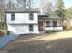 Charming two-story home with a welcoming front porch and a well-maintained yard at 5017 Galbraith Cir, Stone Mountain, GA 30088