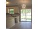 The kitchen overlooks the backyard with stainless steel appliances, white cabinets, and a view of the patio at 5017 Galbraith Cir, Stone Mountain, GA 30088
