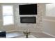 The living room boasts a stone fireplace, modern lighting, and a large television at 5017 Galbraith Cir, Stone Mountain, GA 30088
