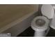 Full bathroom featuring a white tub, toilet, and wood-look floor at 5626 Pine Gate Pine Gate Dr, Atlanta, GA 30349