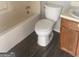 Full bathroom featuring a tub, toilet, and vanity, with a wood-look floor at 5626 Pine Gate Pine Gate Dr, Atlanta, GA 30349