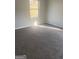 Bedroom featuring neutral paint, carpet, and a bright window with natural sunlight at 5626 Pine Gate Pine Gate Dr, Atlanta, GA 30349