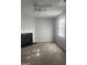 Bright living room featuring a fireplace, ceiling fan, and a large window at 5626 Pine Gate Pine Gate Dr, Atlanta, GA 30349
